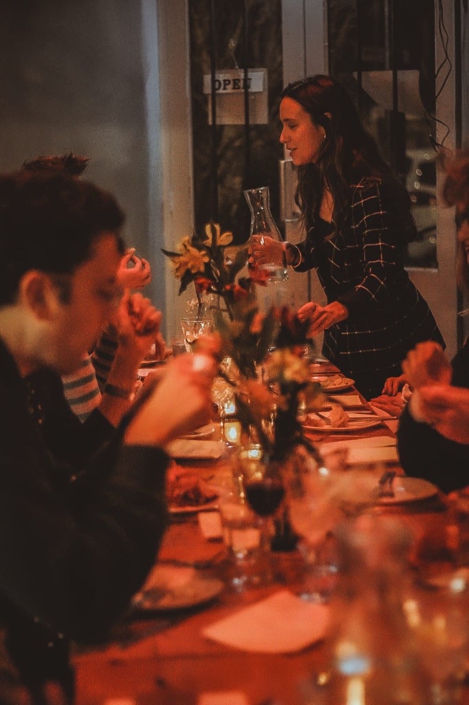 Pouring at a candlelit dinner